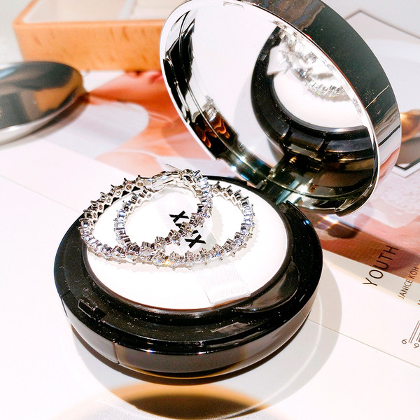 Elegáns női ezüst fülbevaló kerek kövekkel