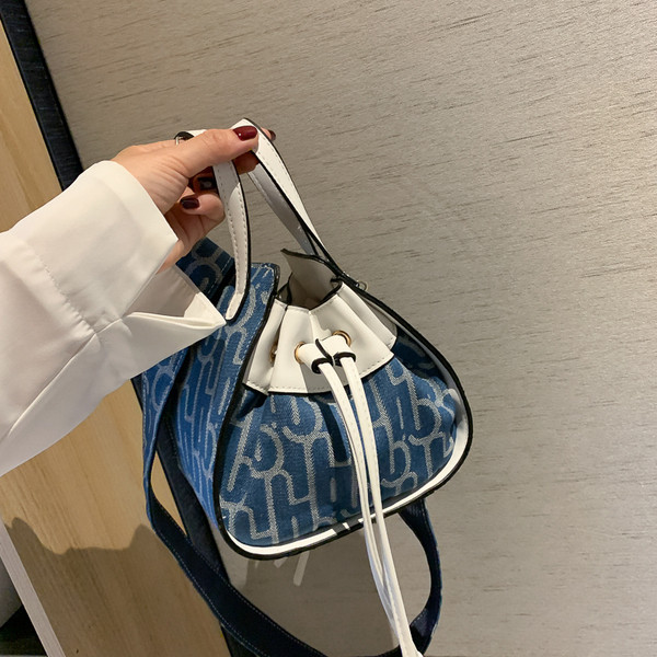 Női modern eco-bőr táska fűzővel