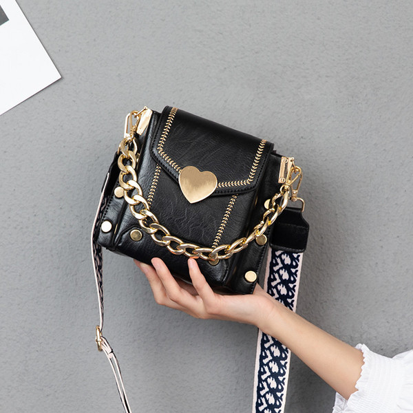 Uue mudeli ökonahast tekstiilist sanga ja metallelementidega naistekott