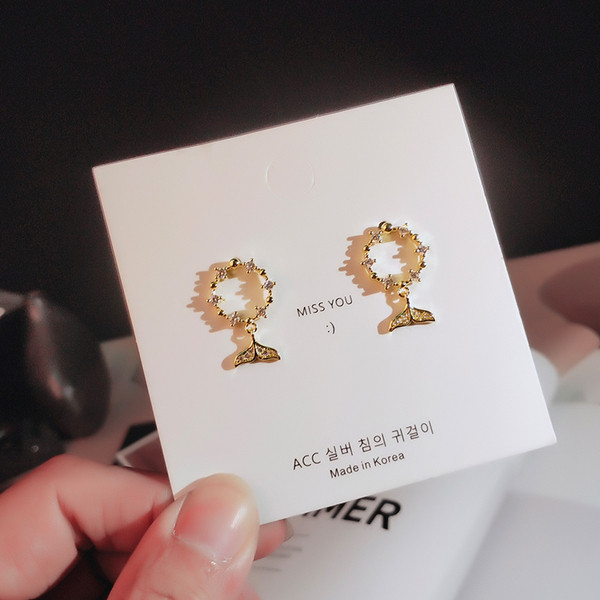 Apaļi sieviešu auskari ar astes kulonu