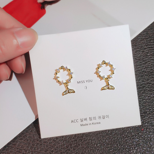 Apaļi sieviešu auskari ar astes kulonu