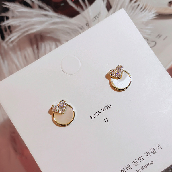 Apaļi sieviešu auskari ar sirds elementu