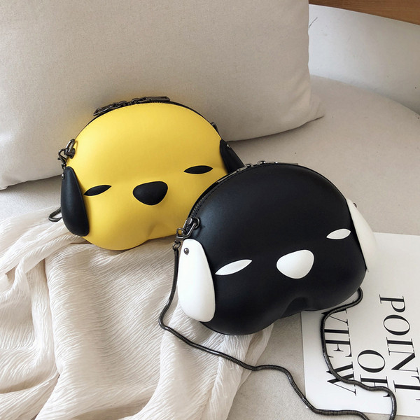 Aktuālā sieviešu soma apaļā formā ar metāla rokturi