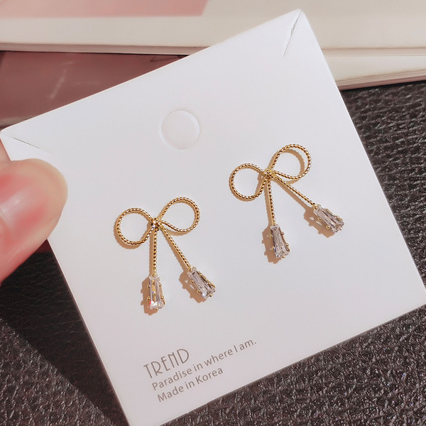 Cercei de dama simpli din aur in forma de panglica