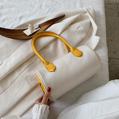 Aktuālā sieviešu soma apaļā formā ar garu rokturi