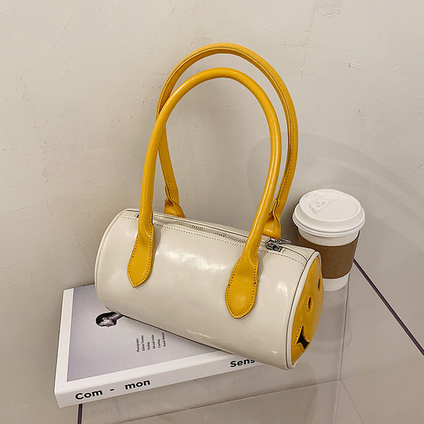 Aktuālā sieviešu soma apaļā formā ar garu rokturi