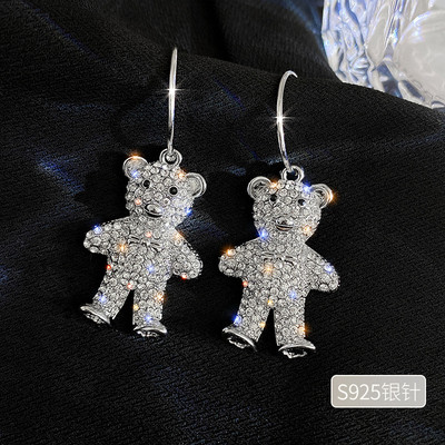 Sudraba sieviešu auskari lāča formā ar akmeņiem