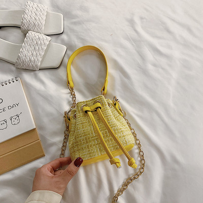 Μοντέρνα γυναικεία μίνι τσάντα από οικολογικό δέρμα με κορδόνια