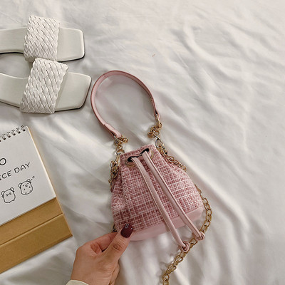 Μοντέρνα γυναικεία μίνι τσάντα από οικολογικό δέρμα με κορδόνια