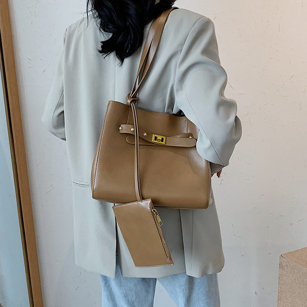 Stilīgs sieviešu somas vienkāršs modelis ar gariem rokturiem