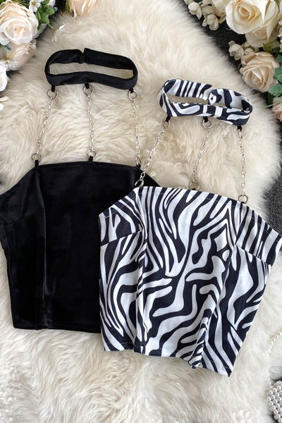 Női sima felső modell vagy kígyómintával és fémláncokkal