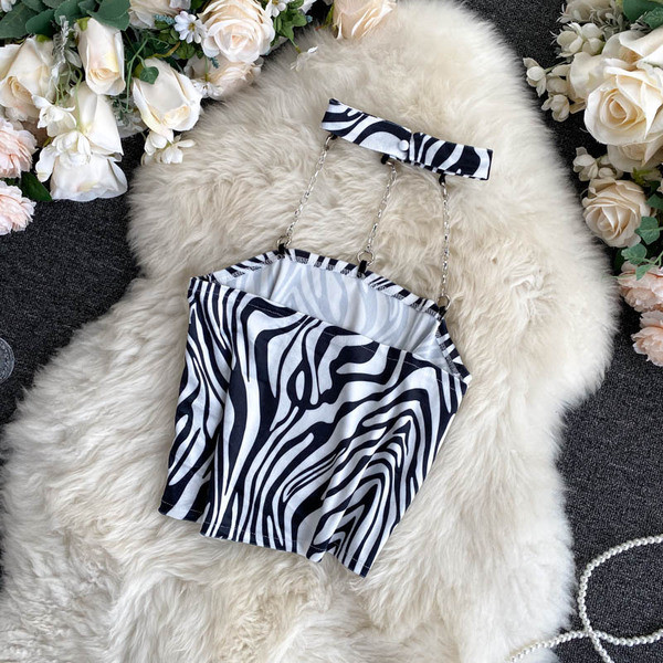 Női sima felső modell vagy kígyómintával és fémláncokkal