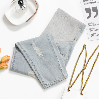 Új modell hosszú női farmer szakadt motívumokkal kismamáknak