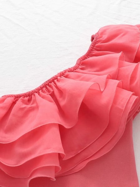 Lühike ühe rihma ja lokkidega rinnakas