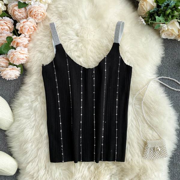 Sieviešu bikses ar V veida kakla izgriezumu un akmeņiem