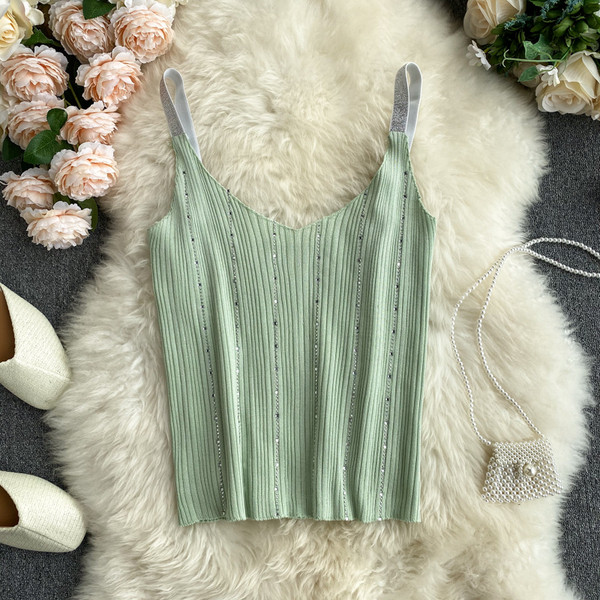 Sieviešu bikses ar V veida kakla izgriezumu un akmeņiem