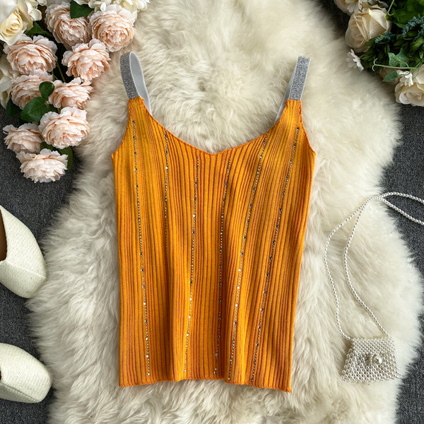 Sieviešu bikses ar V veida kakla izgriezumu un akmeņiem