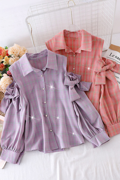 Paljaste õlgade ja paeltega naiste särk