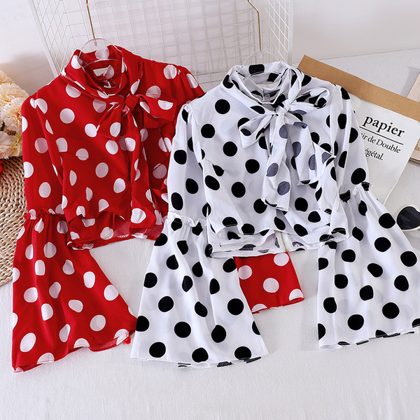 Mitmes värvitoonis paela ja lootosevarrukaga naiste särk