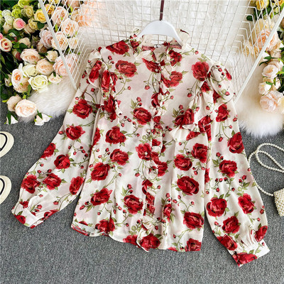 Lillemustri ja pikkade varrukatega naiste moodne särk