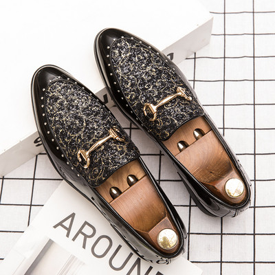 Formal men`s moccasins with a shiny effect and a metal element