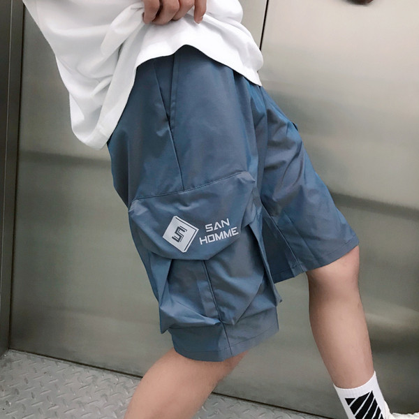 Pantaloni de vara cu buzunare laterale - model lat