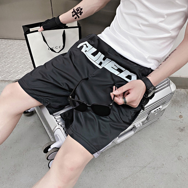 Férfi 3/4-es fekete színű, feliratos nadrág