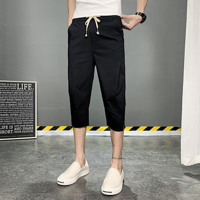 Meeste püksid pikkusega 7/8 ja paeltega