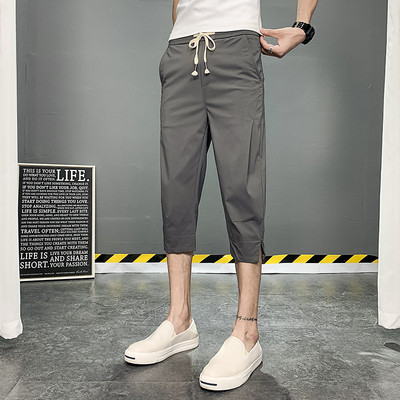 Meeste püksid pikkusega 7/8 ja paeltega