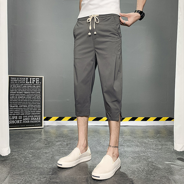 Meeste püksid pikkusega 7/8 ja paeltega