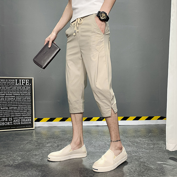 Meeste püksid pikkusega 7/8 ja paeltega