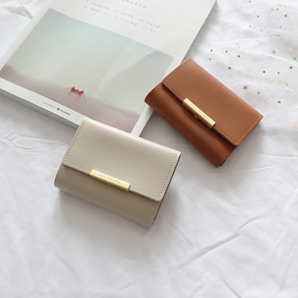 Bőr kis női pénztárca fém rögzítéssel