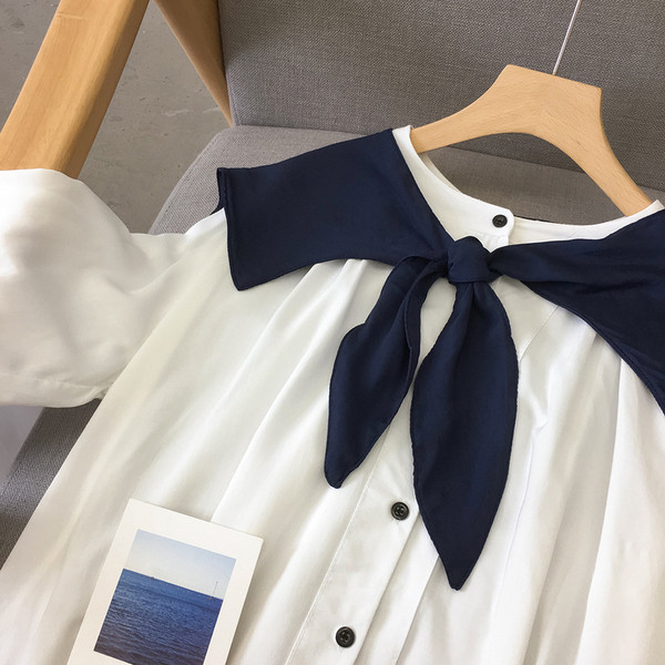 Uue mudeli ümara kaelusega ja pikkade varrukatega naiste särk