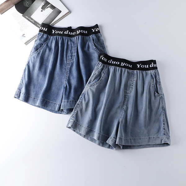 Naiste vabaaja püksid elastse vöökoha ja kirjaga