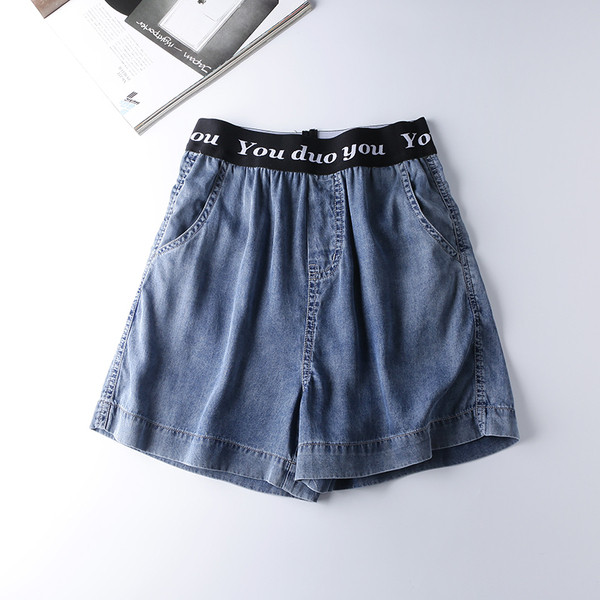 Naiste vabaaja püksid elastse vöökoha ja kirjaga