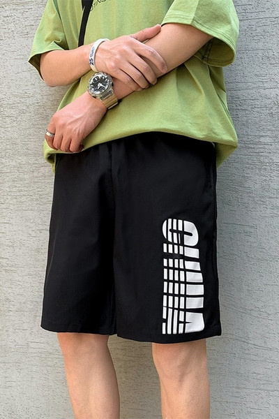 Tavalised 3/4 lühikesed püksid kirjadega