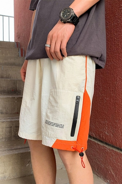 Lühikesed lukuga ja lipsudega lühikesed püksid