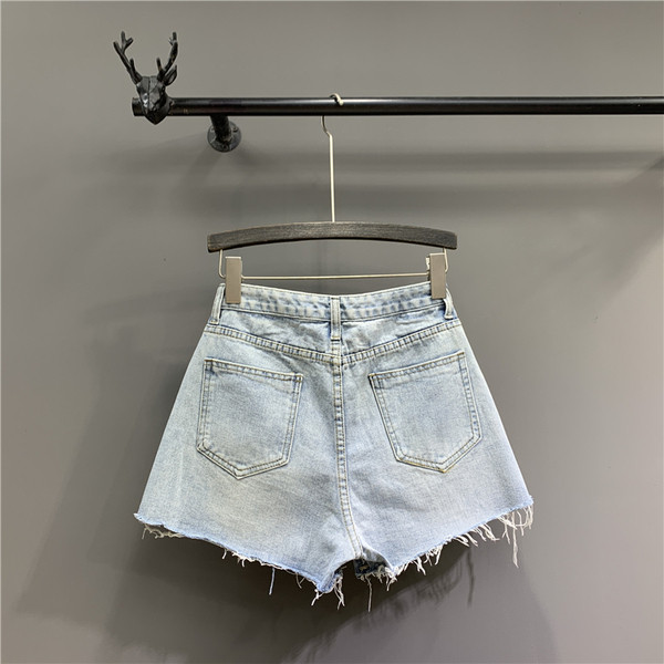 Női rövid farmer új modell cipzárral kék színben