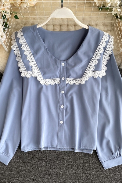 Moodne ümara dekoltee ja nööpidega naiste särk