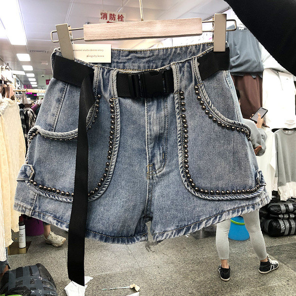 Naiste vöö ja metallelementidega teksapüksid