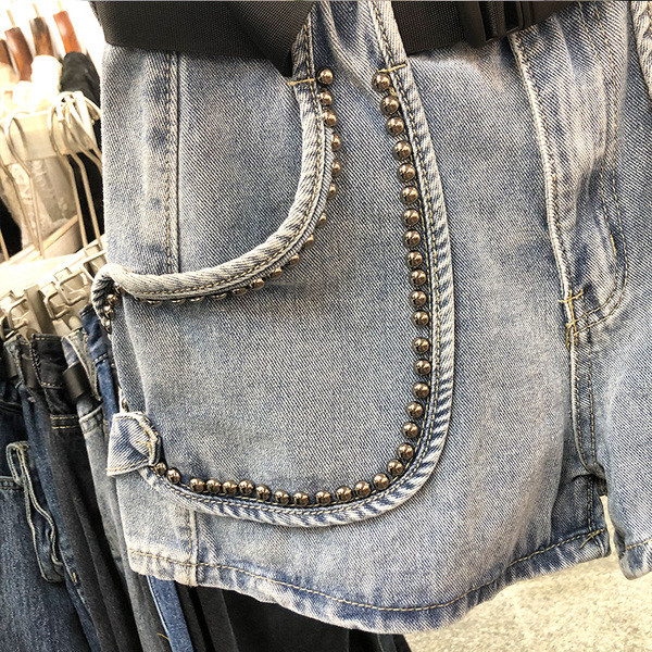 Naiste vöö ja metallelementidega teksapüksid