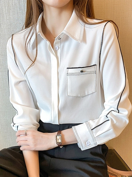 Klassikalise krae ja valge taskuga vabaaja naiste särk