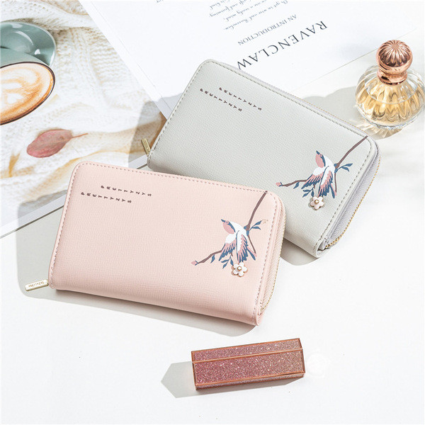 Naiste rahakott tikandi ja lukuga