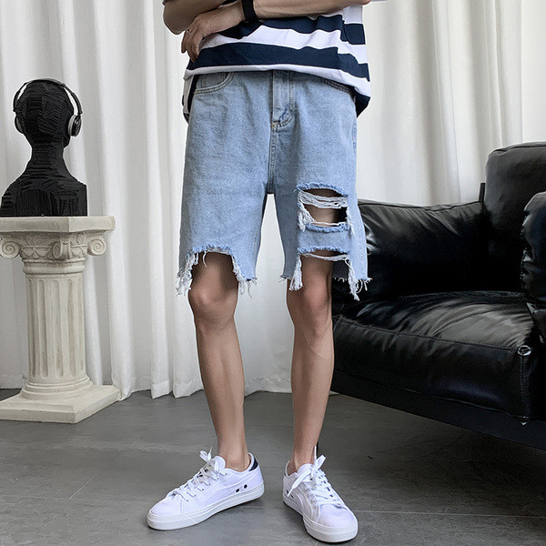 Lai rebenenud motiividega teksapükste mudel