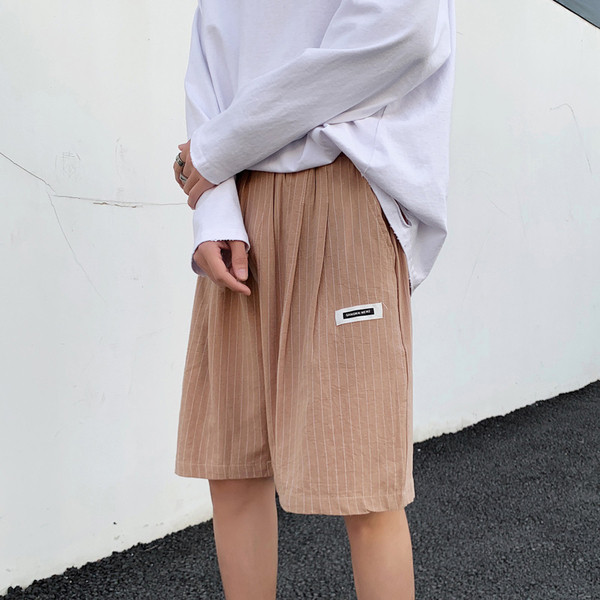 Triibulised 3/4 taskutega püksid