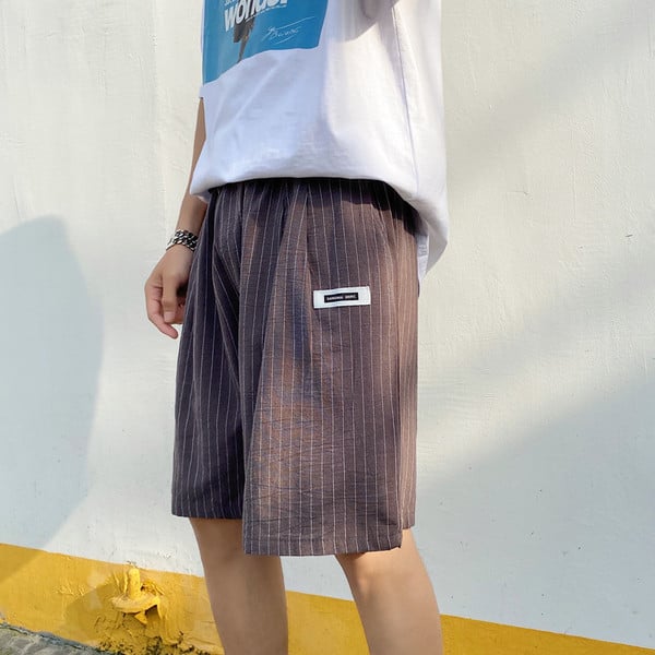 Triibulised 3/4 taskutega püksid