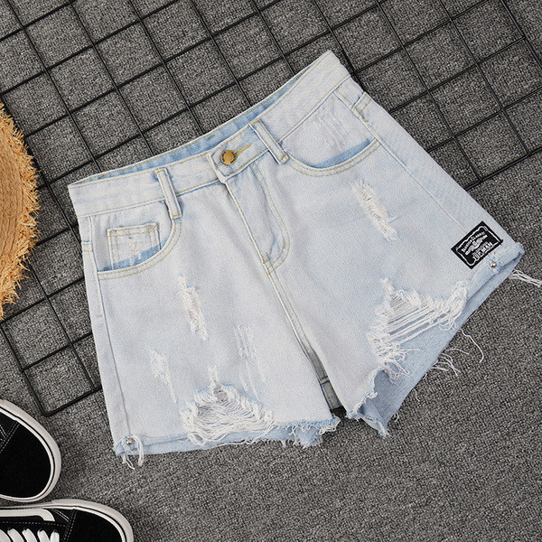 Kõrge vöökoha ja rebenenud motiividega vabaaja naiste lühikesed püksid