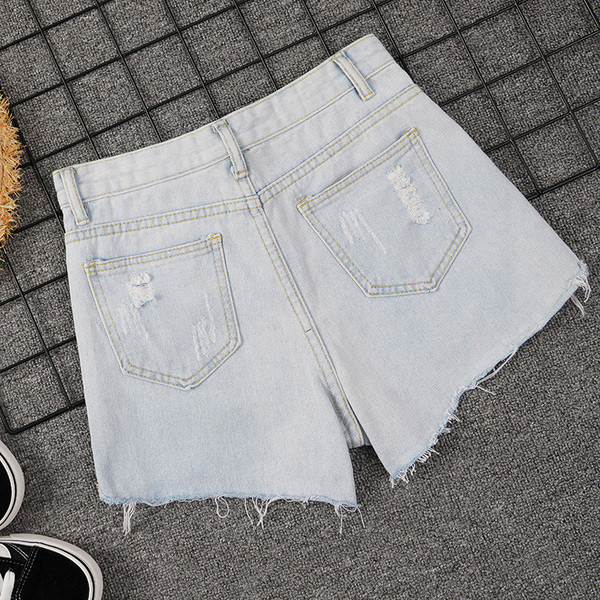 Kõrge vöökoha ja rebenenud motiividega vabaaja naiste lühikesed püksid