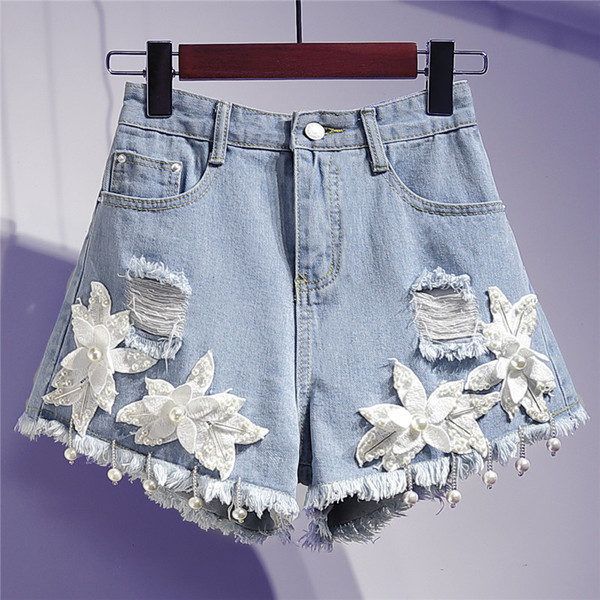 Moodsad kõrge vöökoha ja 3D-elemendiga naiste teksapüksid