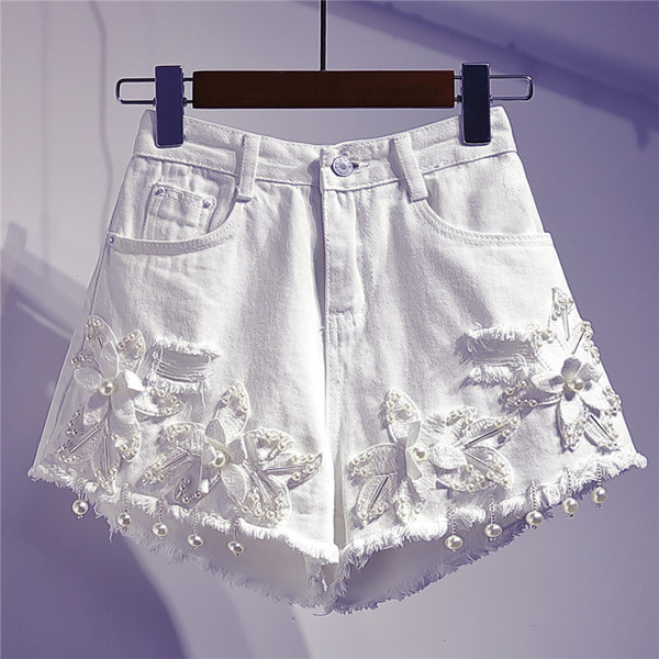 Moodsad kõrge vöökoha ja 3D-elemendiga naiste teksapüksid